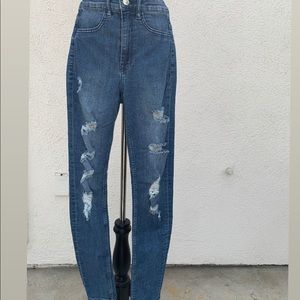 High waisted dark blue jeans.